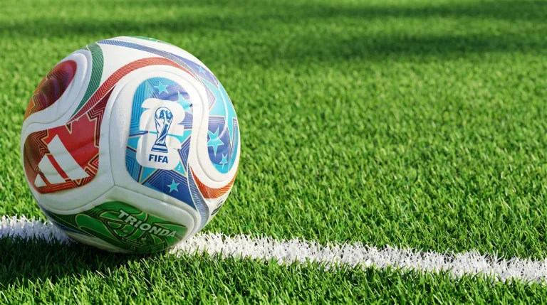 Adidas FIFA World Cup 2026 official match ball on vibrant green soccer field